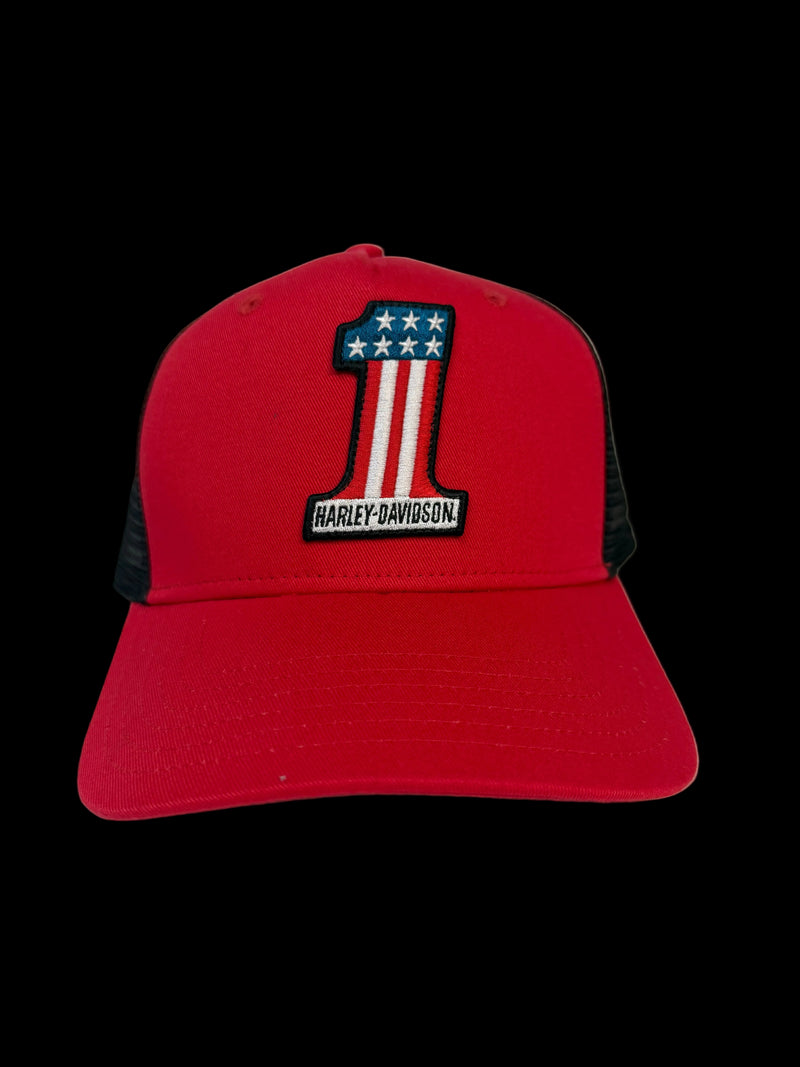 A red and black trucker-style baseball cap featuring a large embroidered number 1 with an American flag design and the Harley-Davidson logo on the front.